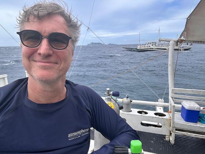 Man wearing No Se sunglasses on a boat
